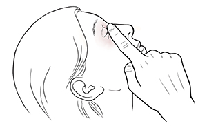 Woman leaning head back with closed eye, pressing finger between eye and nose.